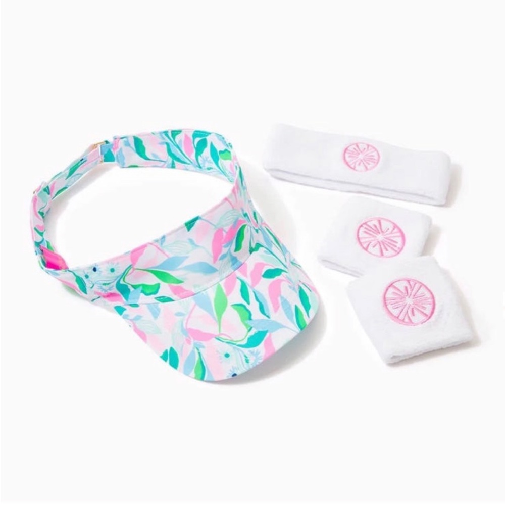 Lilly Pulitzer holding court visor, wristbands, and headband set
